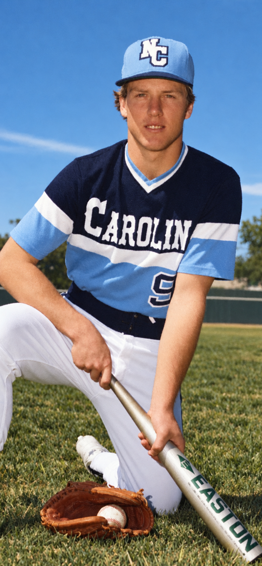 Scott Bradley in his Carolina baseball uniform, holding a bat